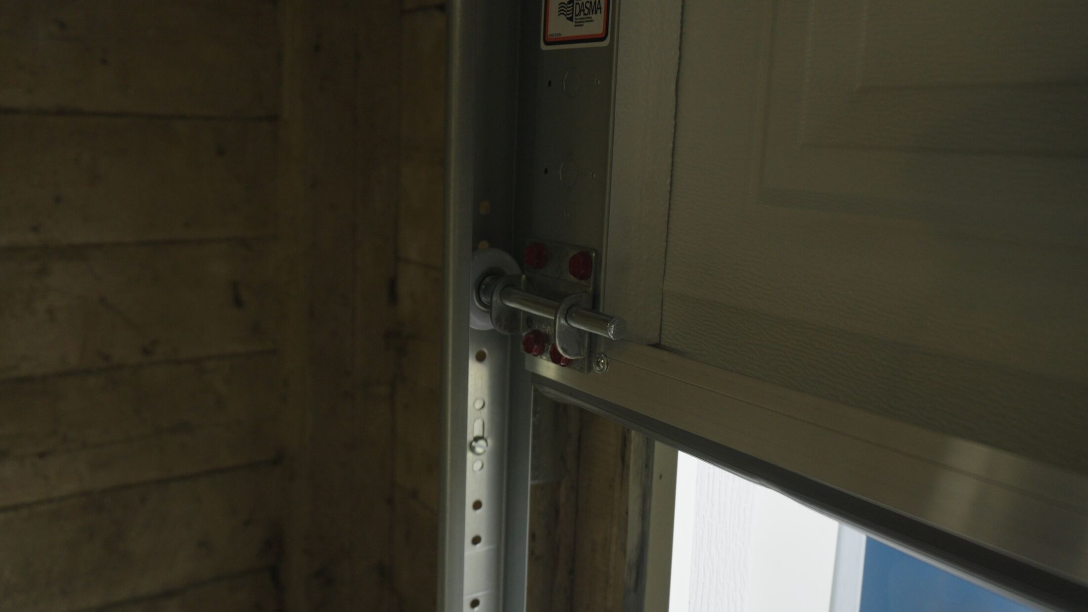 New garage door track and nylon roller fitted after the door was re-seated
