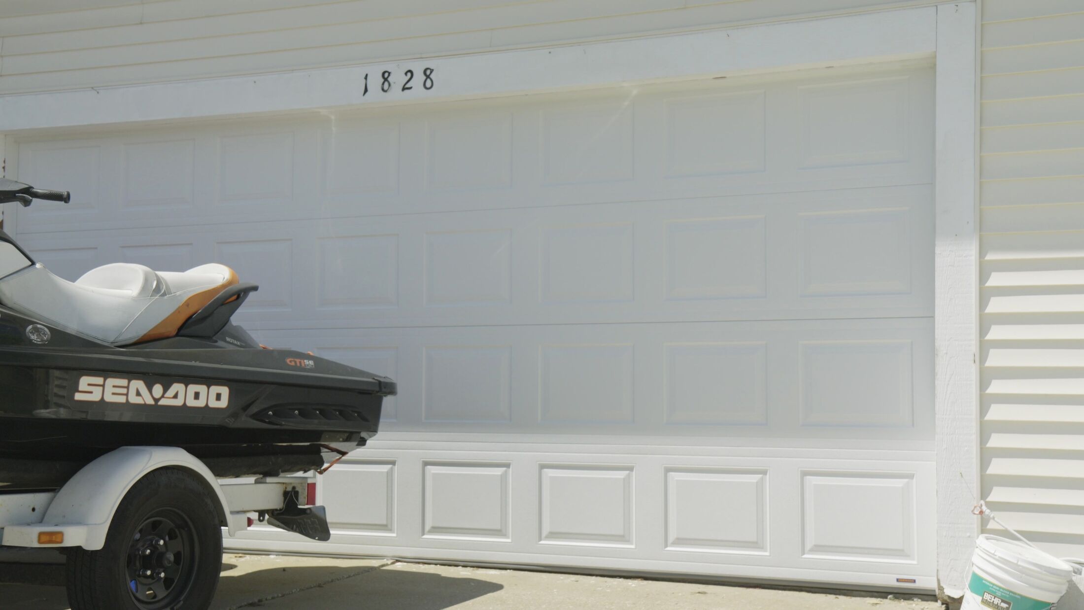 A finished white two-car garage door on a home in the Grand Rapids metro